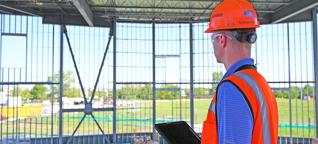 superintendent at jobsite with an ipad