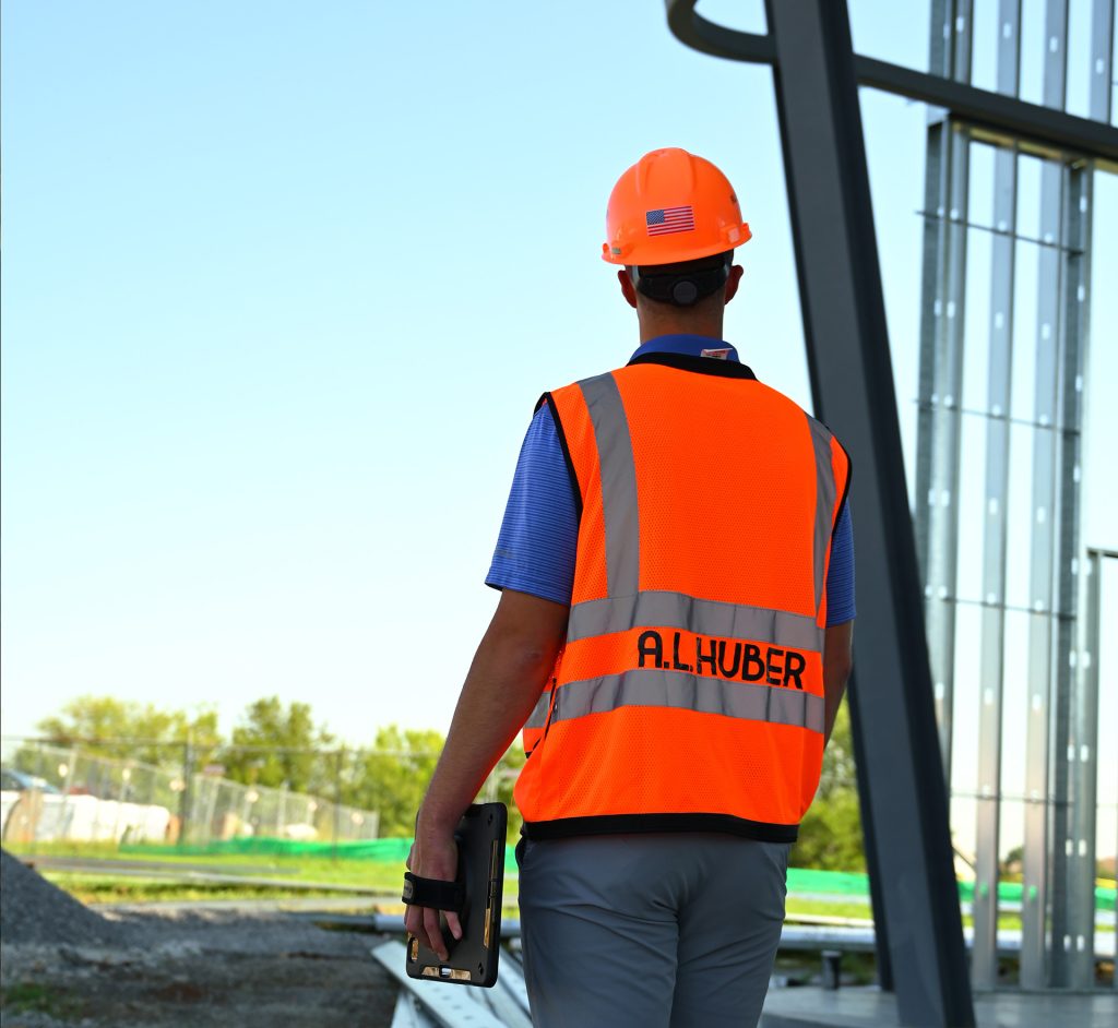 Construction manager at risk evaluating a jobsite