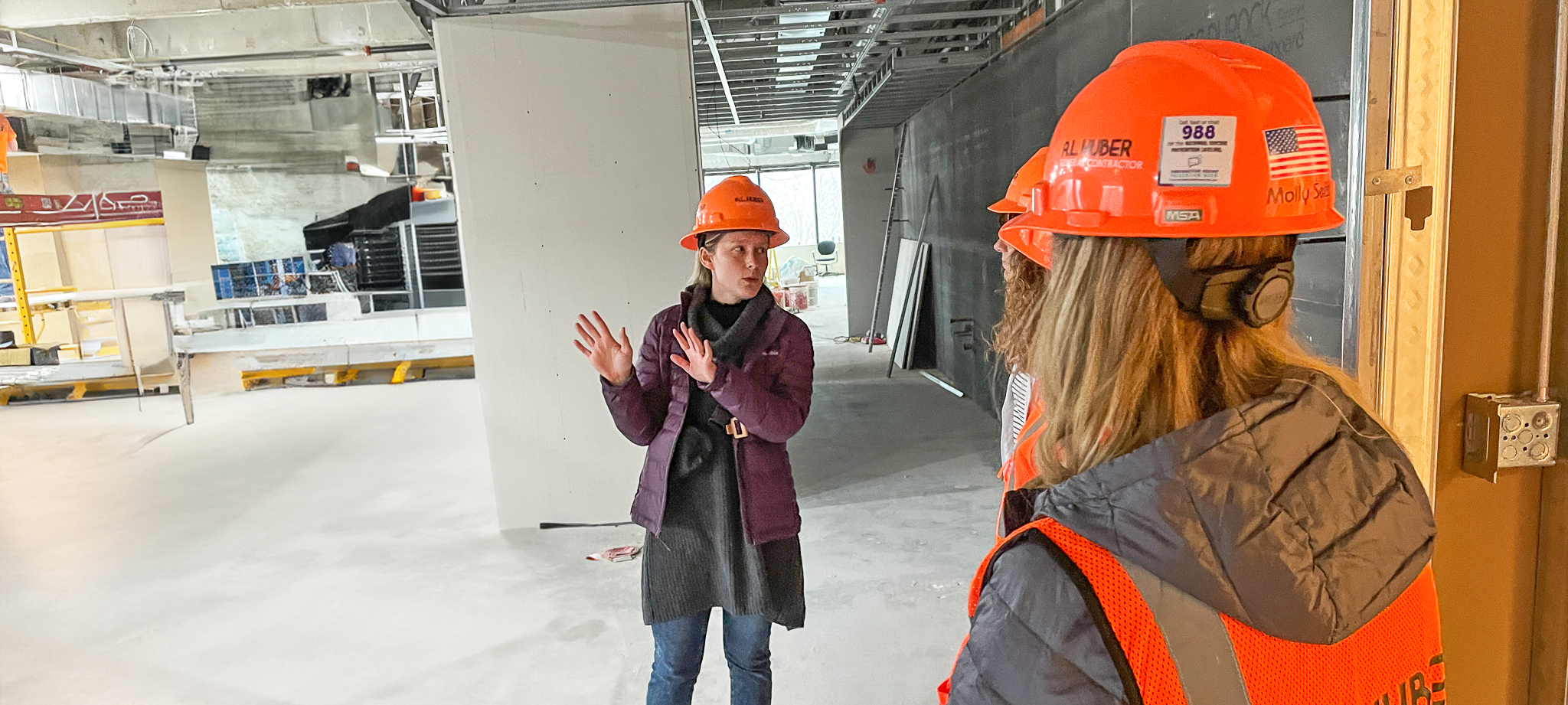 woman project manager on a job site giving a tour